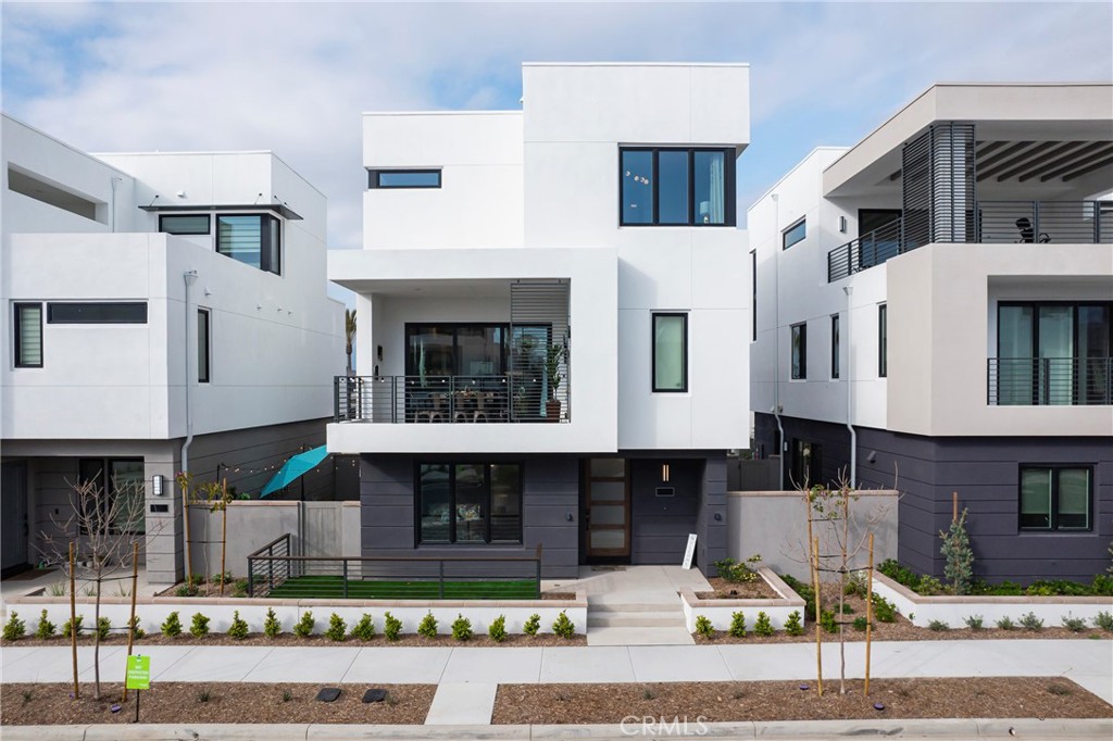2053 Peebler Way Tustin, CA 92782 - Photo 2 of 37 a front view of a building with glass windows