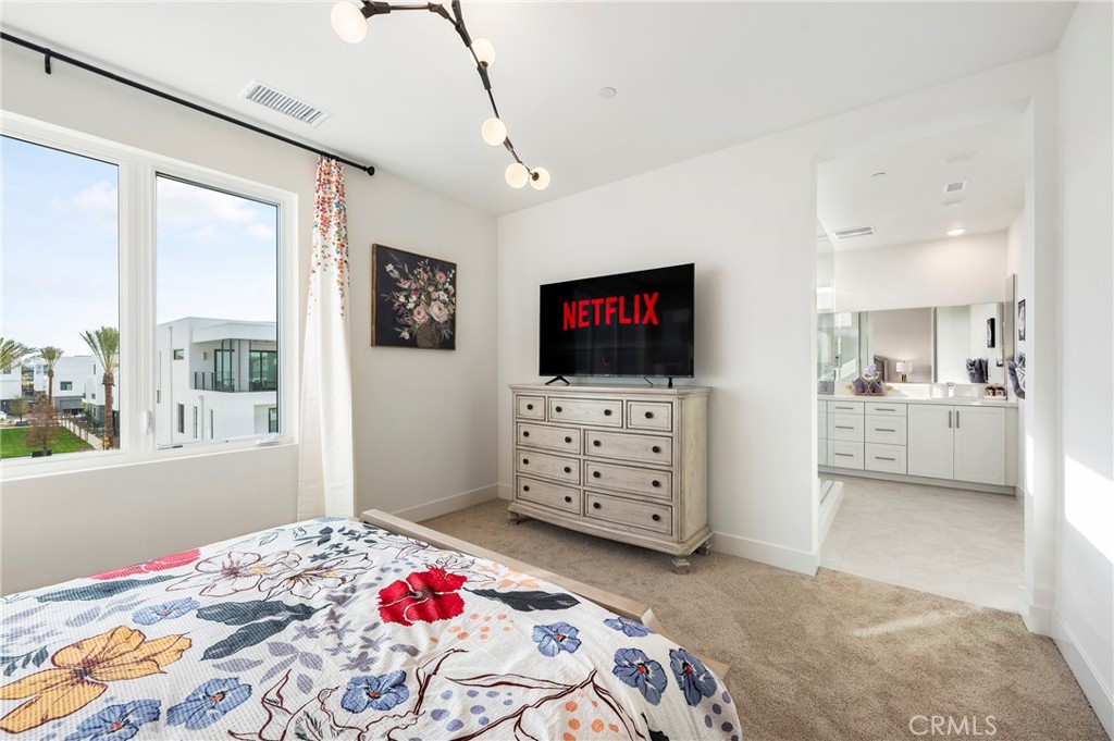 2053 Peebler Way Tustin, CA 92782 - Photo 23 of 37 a bedroom with a bed and flat screen tv