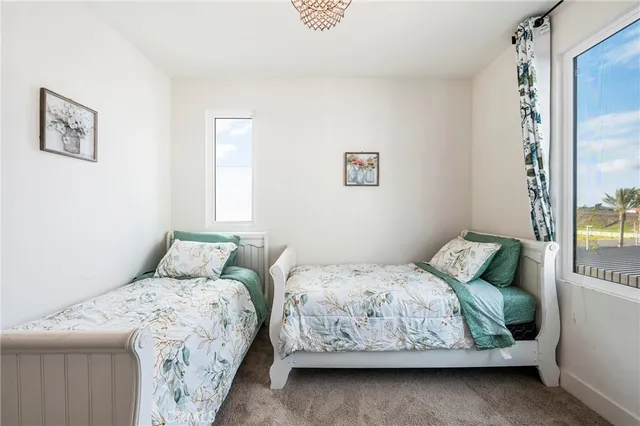 a bedroom with bed and a window