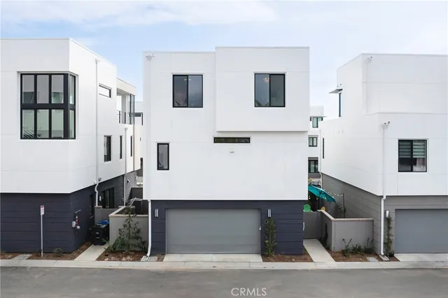 a front view of a house with garage