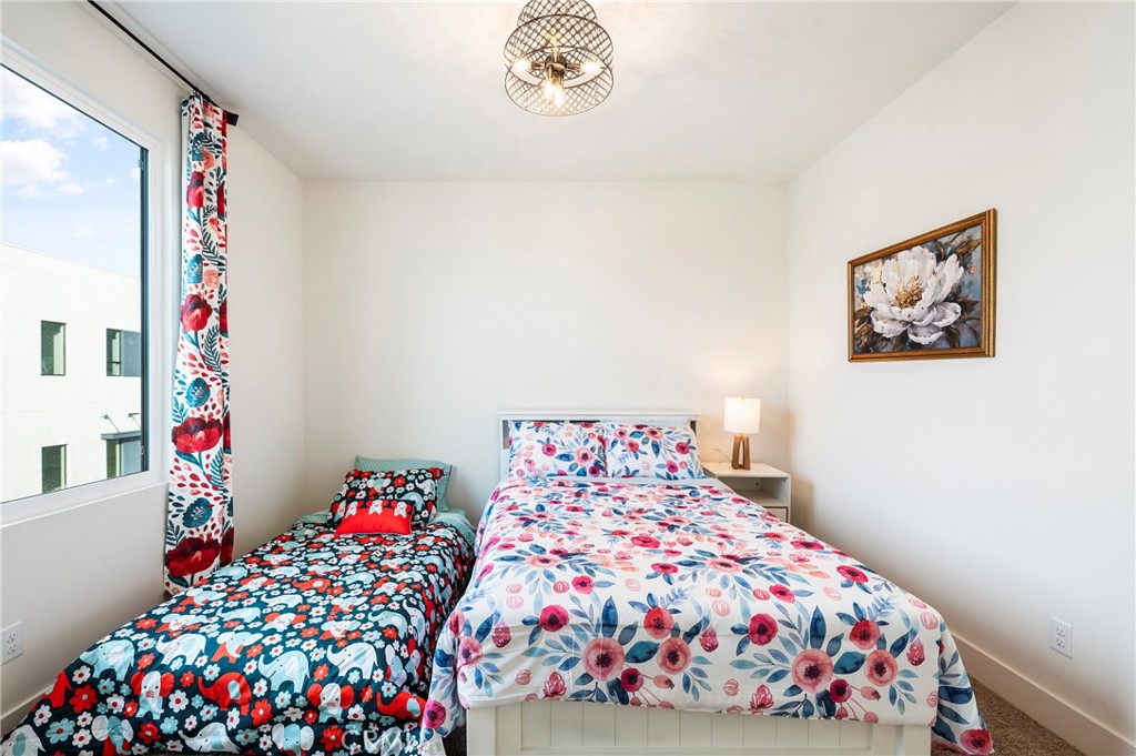 2053 Peebler Way Tustin, CA 92782 - Photo 31 of 37 a bedroom with bed and a window