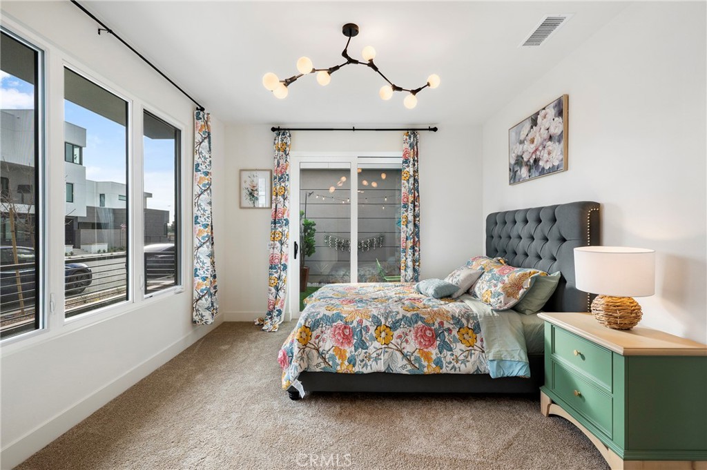 2053 Peebler Way Tustin, CA 92782 - Photo 6 of 37 a bedroom with bed and windows