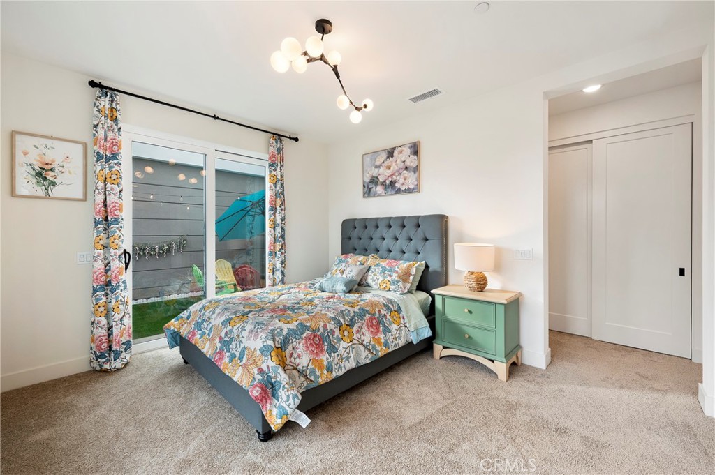 2053 Peebler Way Tustin, CA 92782 - Photo 7 of 37 a bedroom with a bed and a cabinets