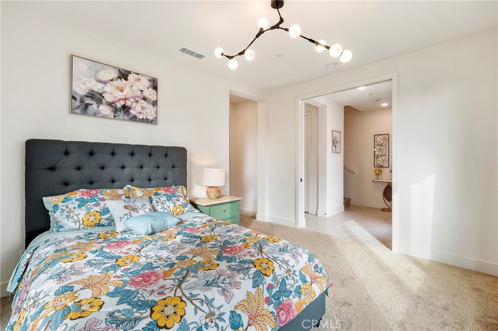 2053 Peebler Way Tustin, CA 92782 - Photo 8 of 37 a bedroom with bed and wooden floor