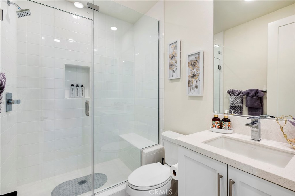 2053 Peebler Way Tustin, CA 92782 - Photo 9 of 37 a bathroom with a sink toilet tub and shower