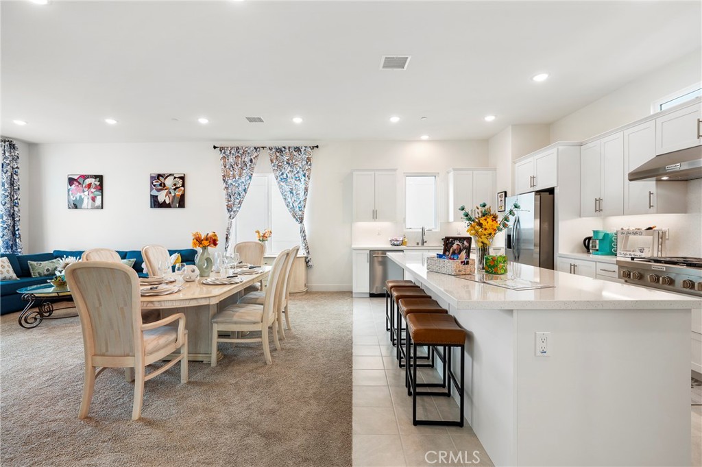 2053 Peebler Way Tustin, CA 92782 - Photo 10 of 37 a view of a dining room with furniture