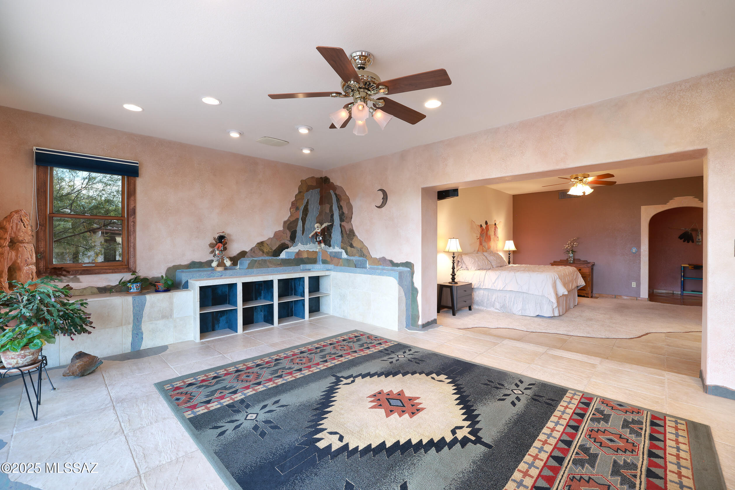 925 North Rancho Del Jefe Loop Tucson, AZ 85748 - Photo 21 of 52 a bed room with a bed and a chandelier
