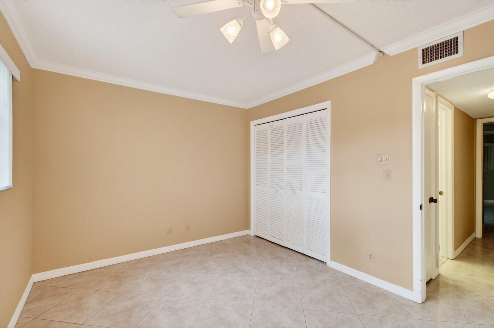 3951 Northeast 19th Road, Unit 1701 Pompano Beach, FL 33064 - Photo 42 of 82 an empty room with a empty space and a ceiling fan