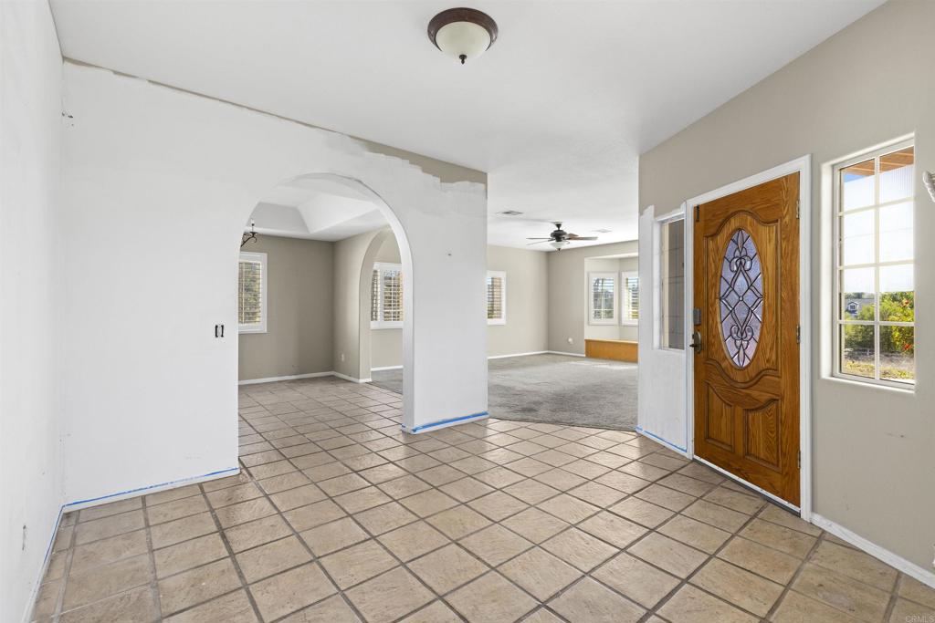 1007 Capra Way Fallbrook, CA 92028 - Photo 15 of 44 a view of livingroom with window and couch