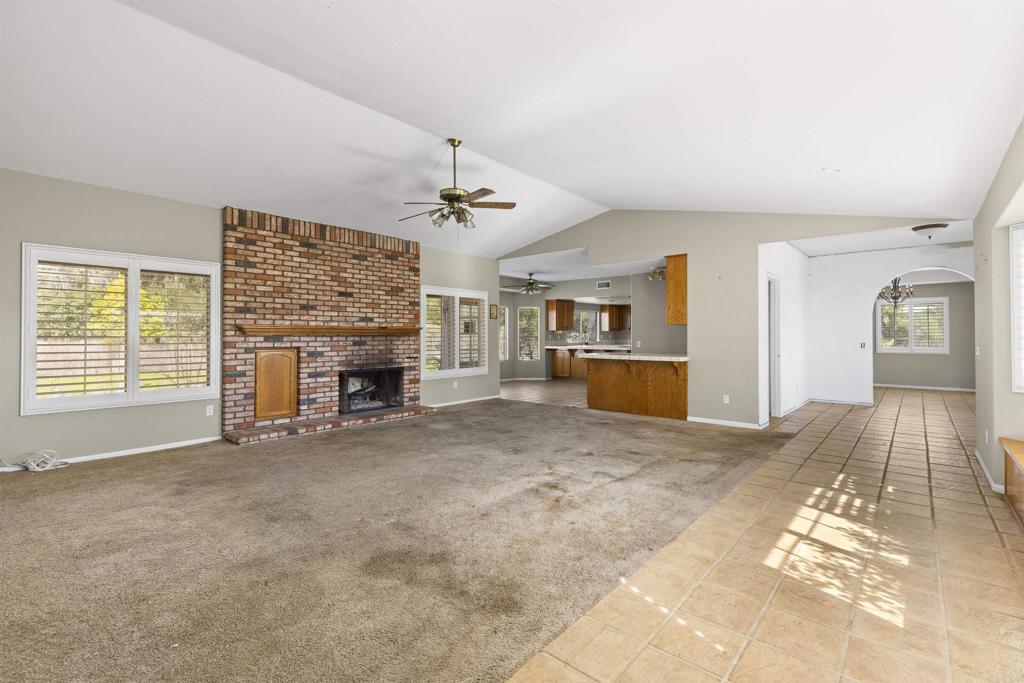 1007 Capra Way Fallbrook, CA 92028 - Photo 28 of 44 a view of a livingroom with a fireplace and a window
