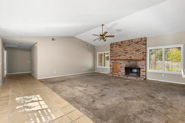a bathroom with a granite countertop sink a toilet and a mirror