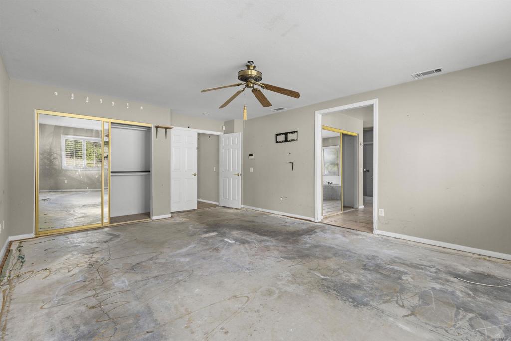 1007 Capra Way Fallbrook, CA 92028 - Photo 32 of 44 a view of empty room with wooden floor and fan