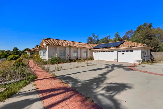 a view of a road with a building in the background
