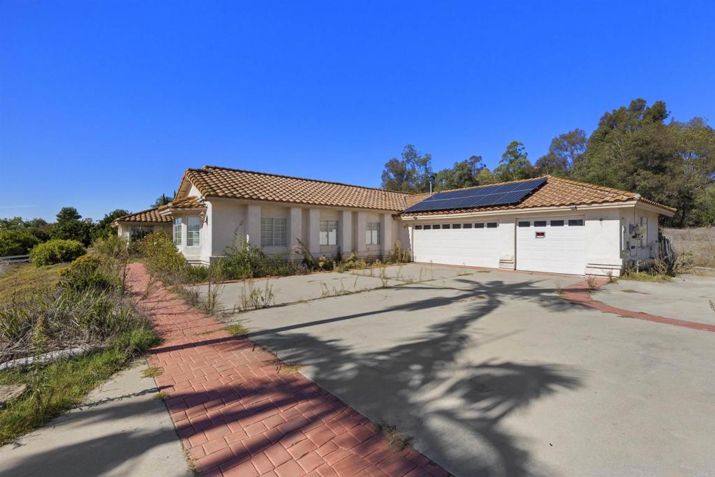 1007 Capra Way Fallbrook, CA 92028 - Photo 5 of 44 a view of a house with a street
