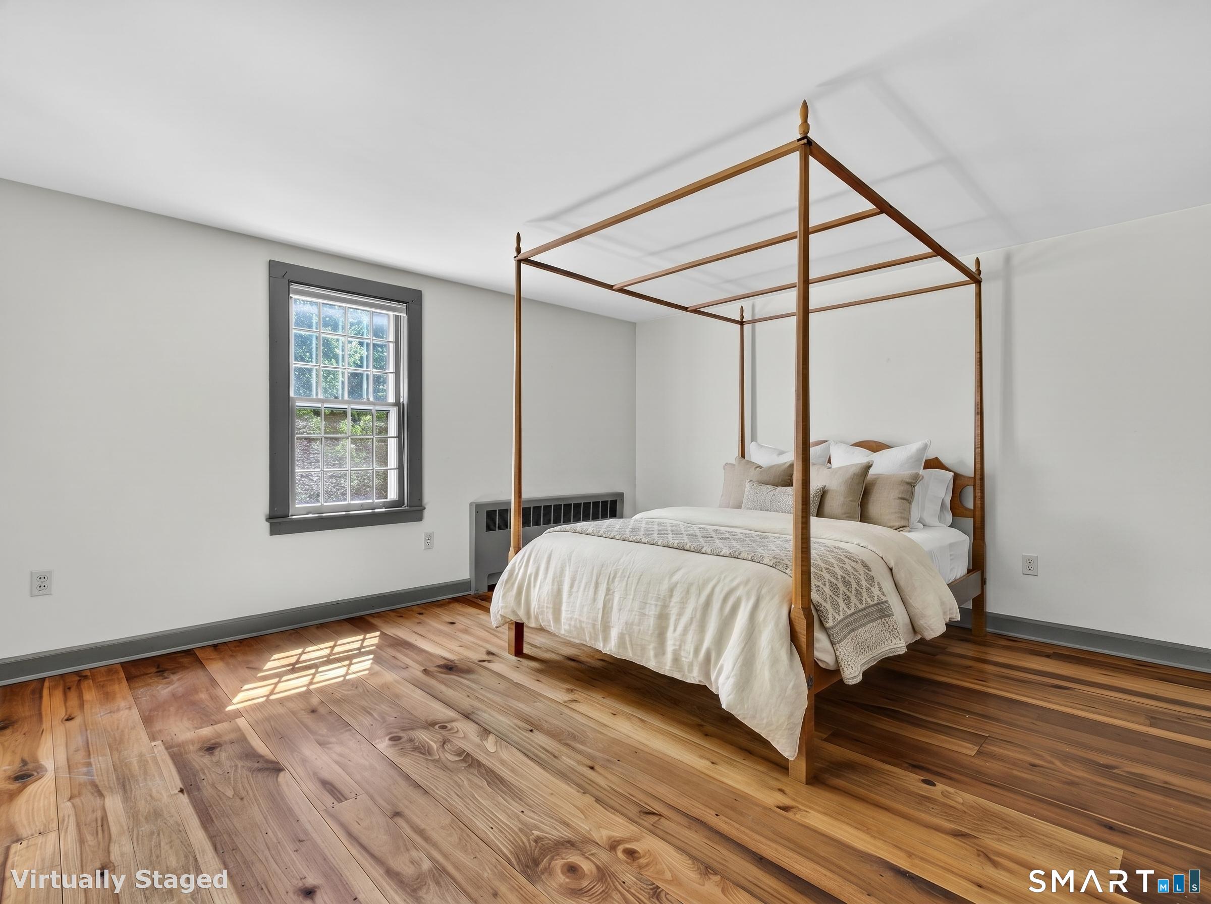 14 Cow Pen Hill Road Killingworth, CT 06419 - Photo 29 of 40 Each bedroom offers generous proportions, hardwood flooring, and multiple windows that fill the space with natural light throughout the day.