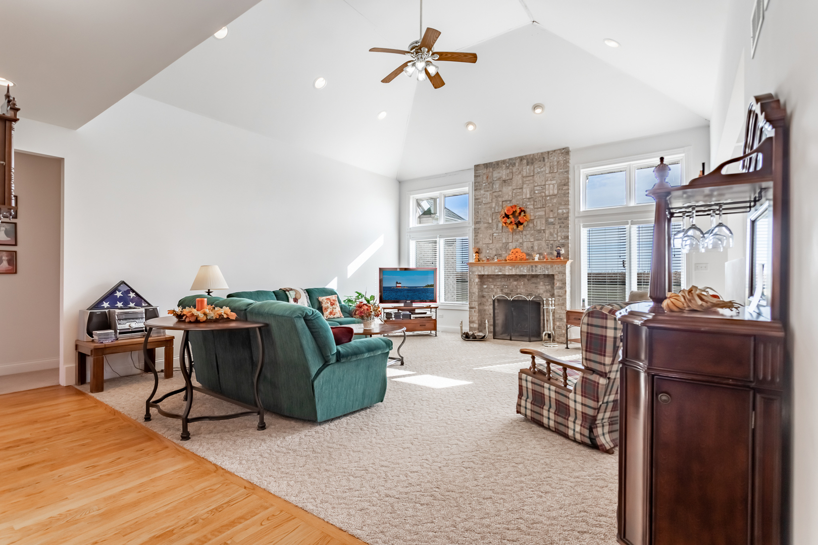 2019 East Kentucky Road Beecher, IL 60401 - Photo 26 of 47 a living room with furniture a fireplace and a flat screen tv