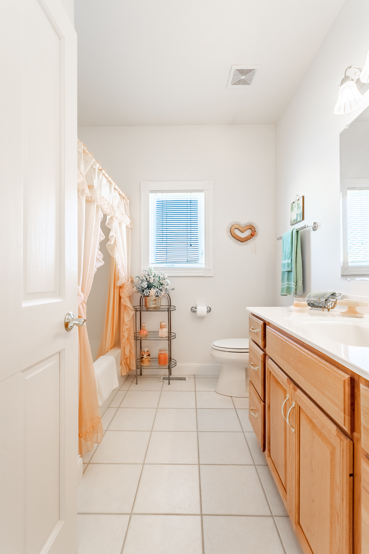 2019 East Kentucky Road Beecher, IL 60401 - Photo 42 of 47 a spacious bathroom with a granite countertop sink a toilet and a mirror