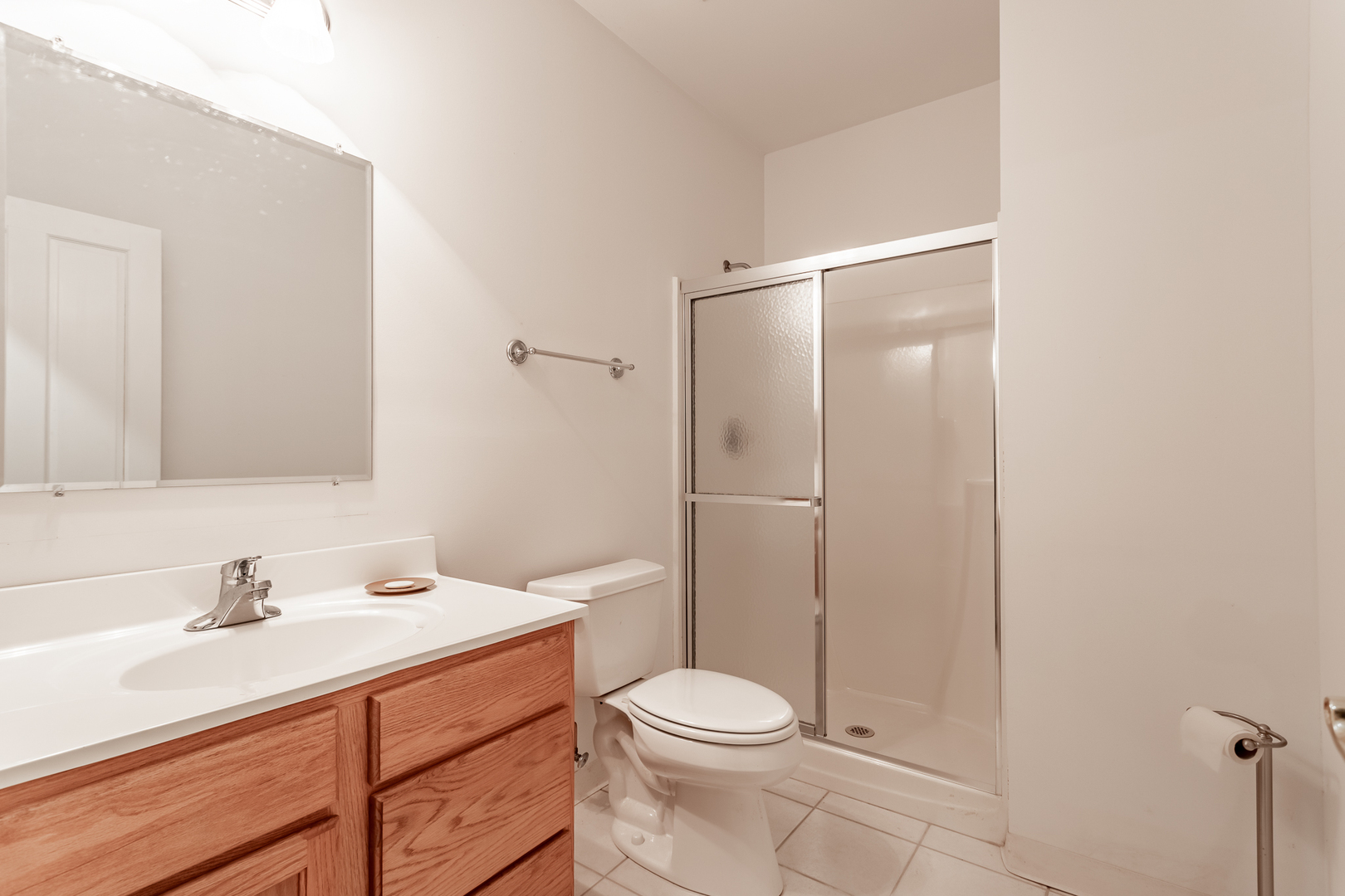 2019 East Kentucky Road Beecher, IL 60401 - Photo 44 of 47 a bathroom with a toilet a sink a mirror and vanity