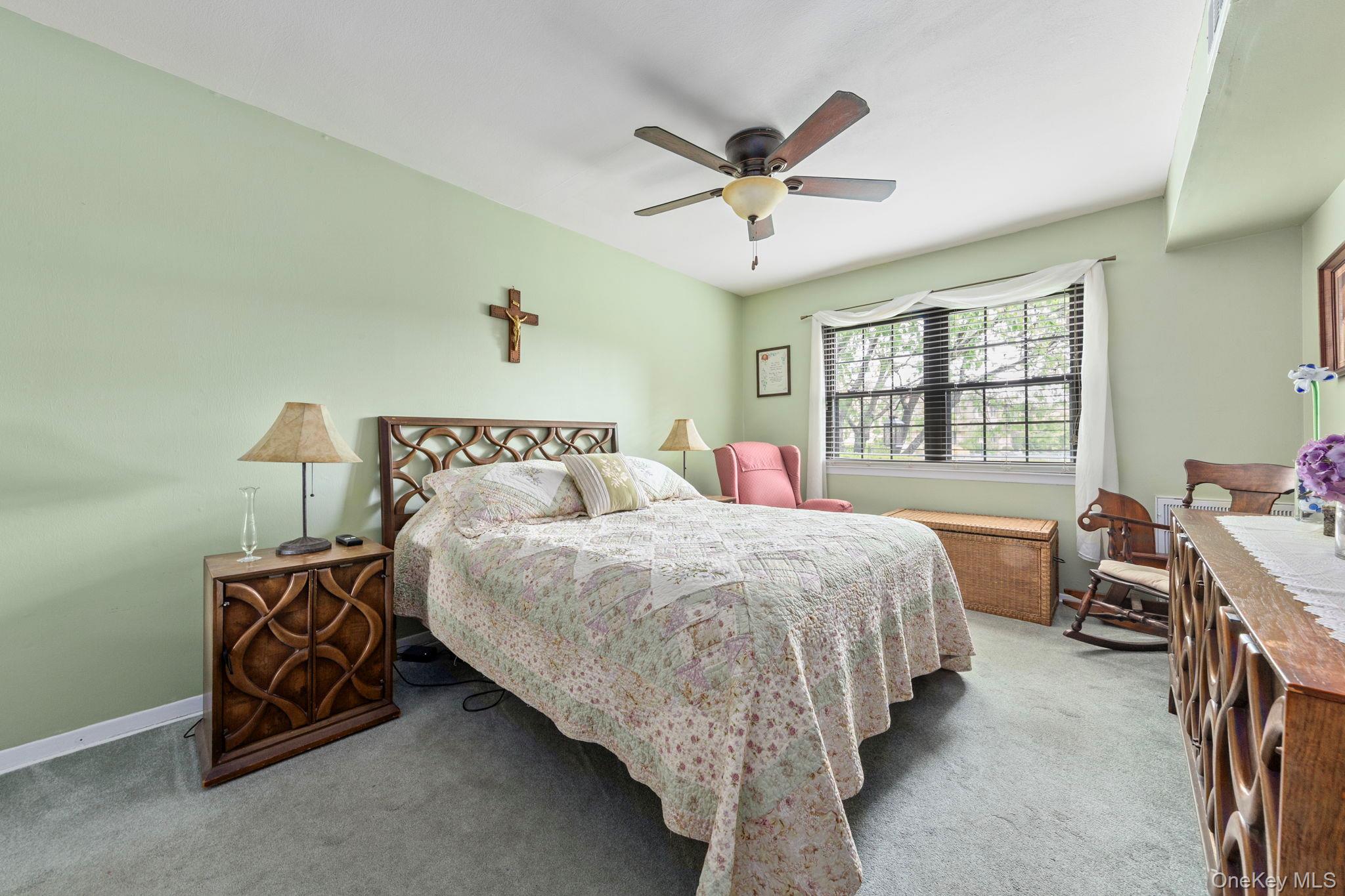 248 Mariners Way Copiague, NY 11726 - Photo 9 of 18 a bedroom with bed and window