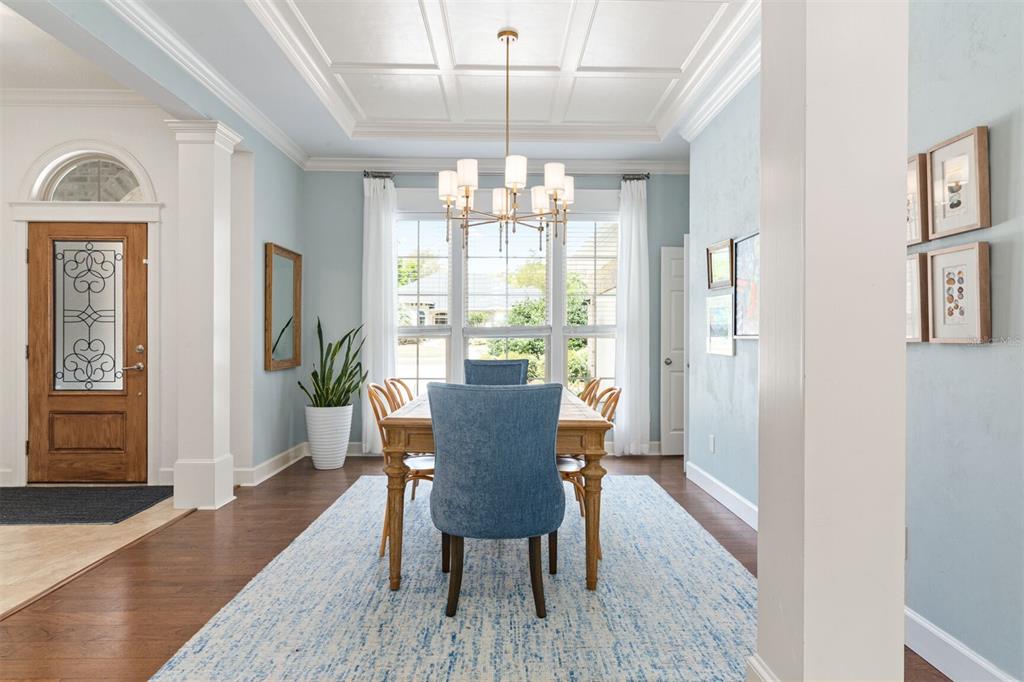 10257 Southwest 37 Place Gainesville, FL 32608 - Photo 11 of 44 a view of a dining room with furniture window and wooden floor