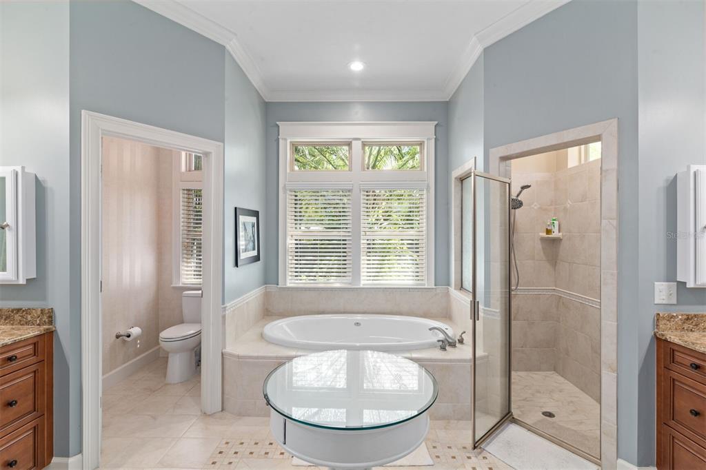 10257 Southwest 37 Place Gainesville, FL 32608 - Photo 21 of 44 a bathroom with a granite countertop sink a toilet and shower