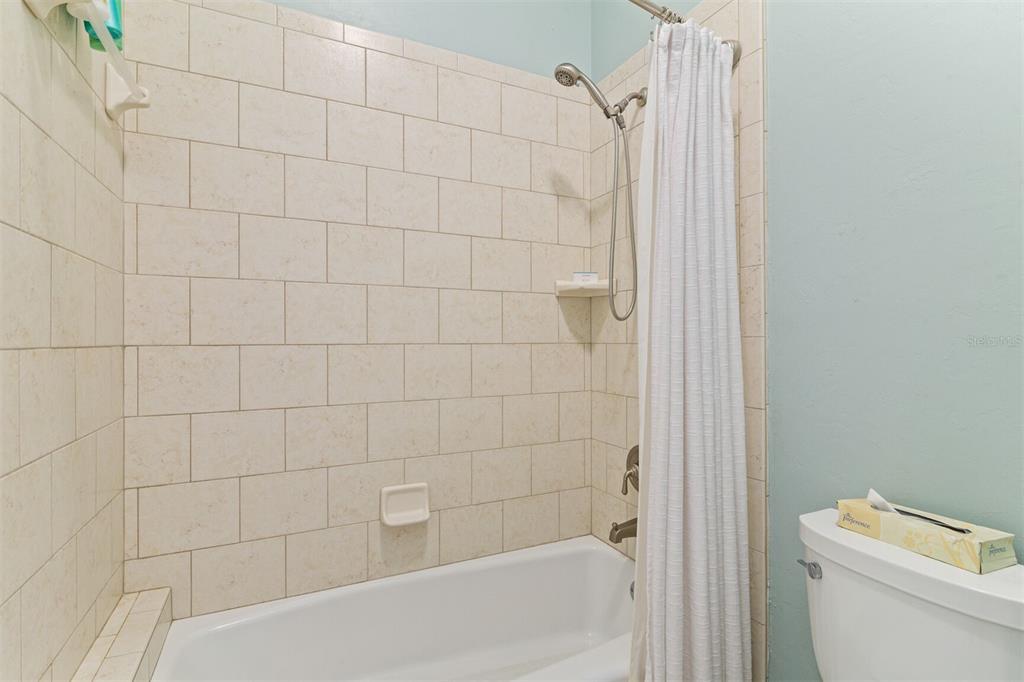 10257 Southwest 37 Place Gainesville, FL 32608 - Photo 30 of 44 a bathroom with a shower and a toilet