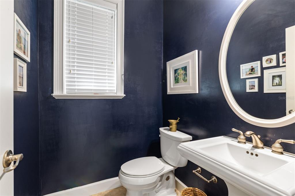 10257 Southwest 37 Place Gainesville, FL 32608 - Photo 32 of 44 a bathroom with a toilet a sink and mirror