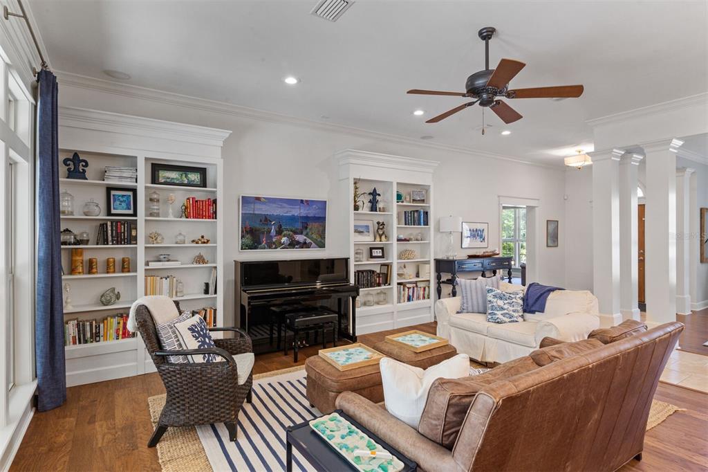 10257 Southwest 37 Place Gainesville, FL 32608 - Photo 9 of 44 a living room with furniture a rug and a bookshelf