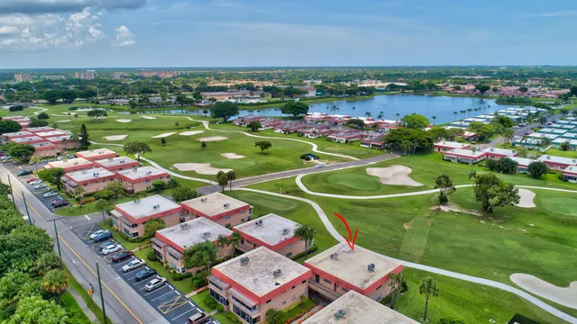 a view of a lake with houses in the background