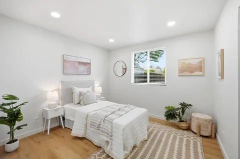 a bedroom with a bed and a table