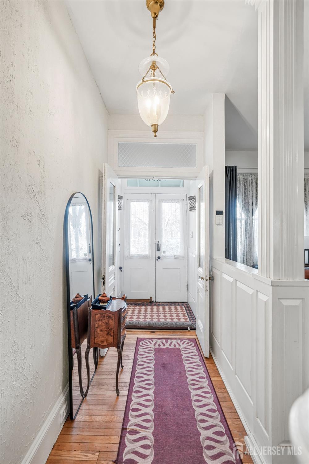 346 East Union Street Burlington, NJ 08016 - Photo 6 of 48 a view of a hallway with wooden floor and windows