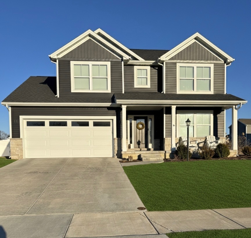 718 Cole Lane Mahomet, IL 61853 - Photo 1 of 22 a front view of a house with a yard