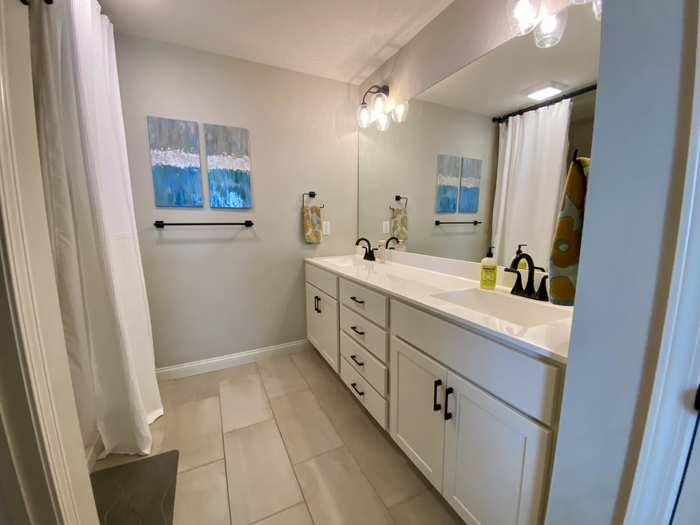 718 Cole Lane Mahomet, IL 61853 - Photo 12 of 22 a spacious bathroom with a double vanity sink a mirror and a shower