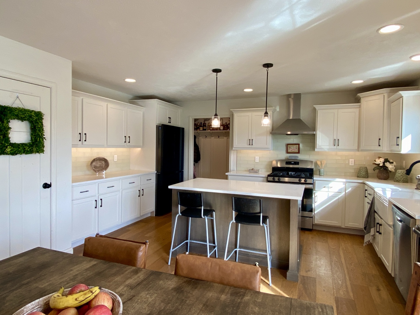 718 Cole Lane Mahomet, IL 61853 - Photo 3 of 22 a kitchen with stainless steel appliances kitchen island granite countertop a sink a stove and a refrigerator