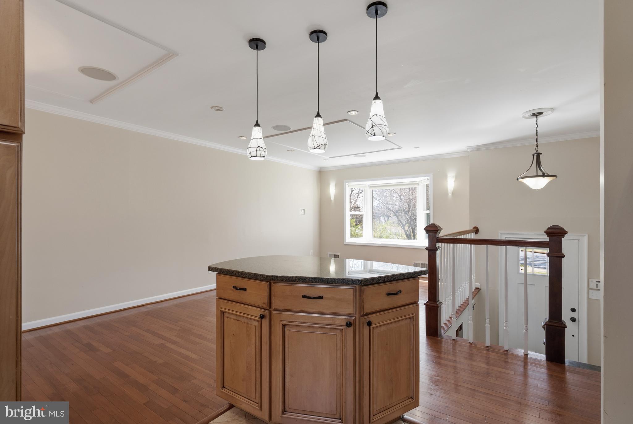 124 Woodland Road Gaithersburg, MD 20877 - Photo 18 of 79 a view of a kitchen with furniture and window