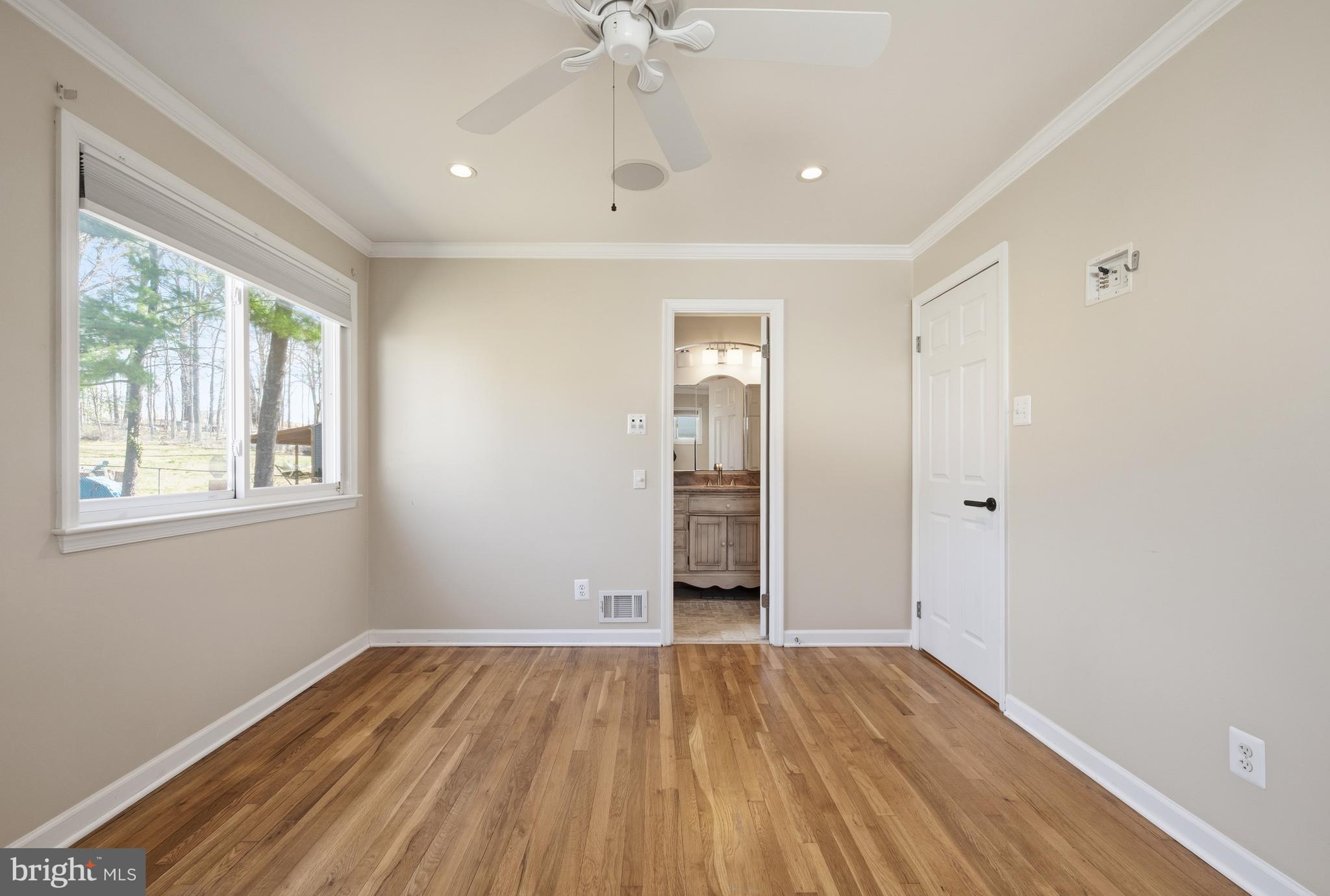 124 Woodland Road Gaithersburg, MD 20877 - Photo 21 of 79 wooden floor in an empty room with a window