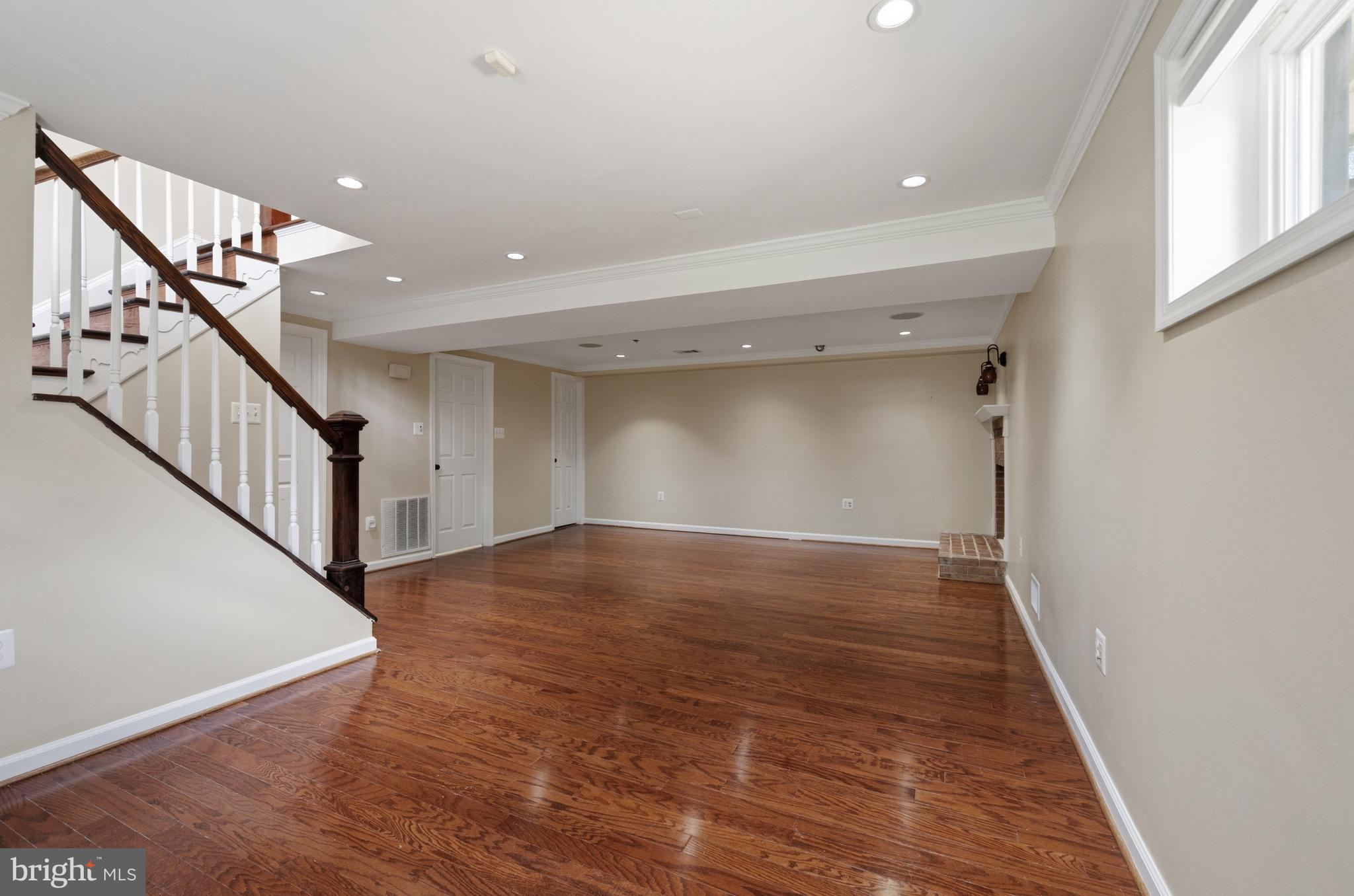 124 Woodland Road Gaithersburg, MD 20877 - Photo 31 of 79 a view of empty room with wooden floor and fan