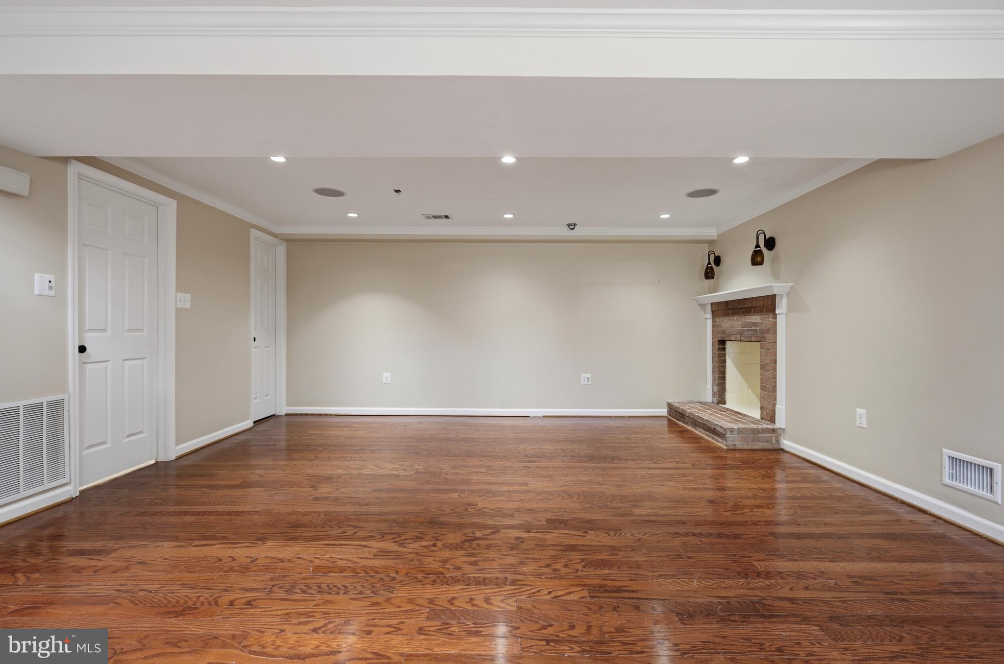 124 Woodland Road Gaithersburg, MD 20877 - Photo 32 of 79 a view of an empty room with wooden floor and closet