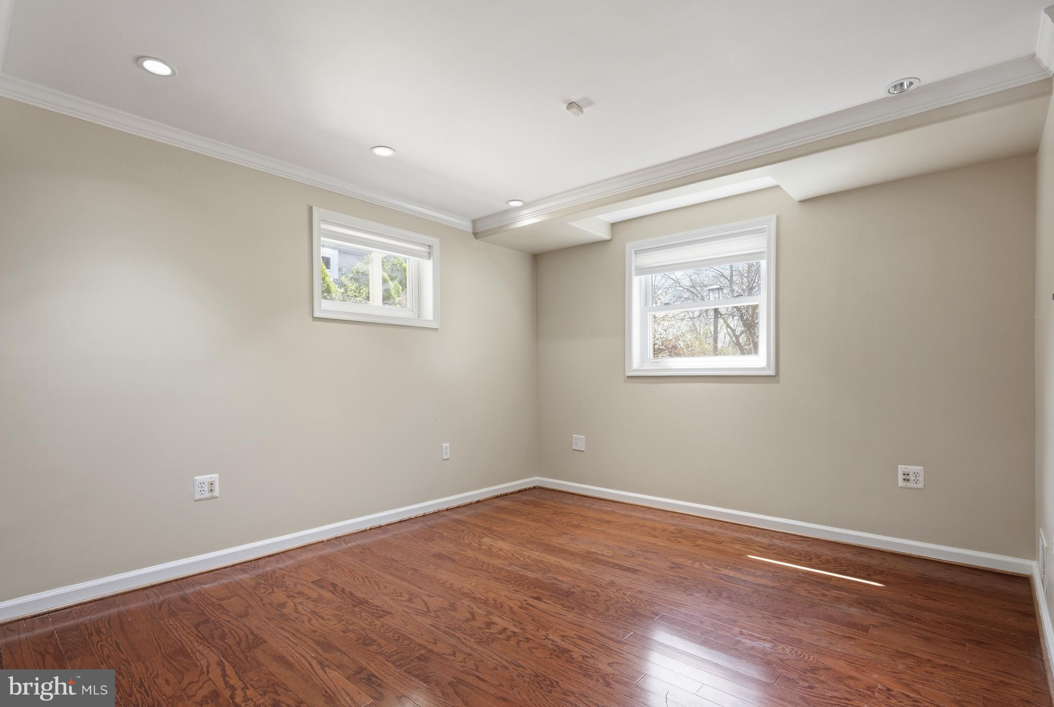 124 Woodland Road Gaithersburg, MD 20877 - Photo 34 of 79 a view of a room with wooden floor and window