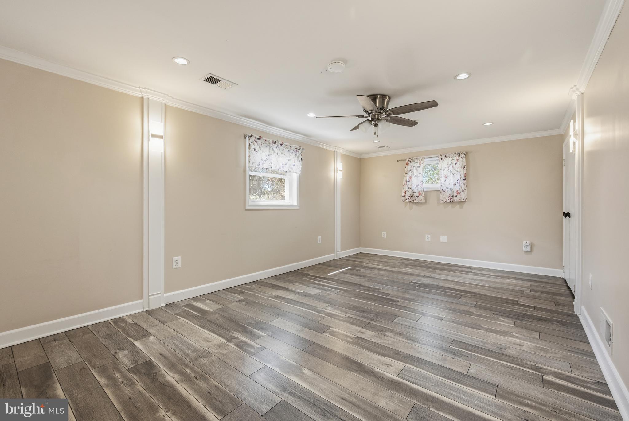 124 Woodland Road Gaithersburg, MD 20877 - Photo 36 of 79 wooden floor in an empty room with a window