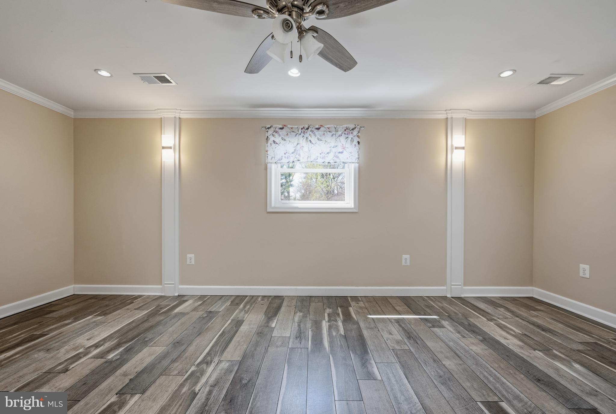 124 Woodland Road Gaithersburg, MD 20877 - Photo 40 of 79 a view of room with hardwood floor and ceiling fan