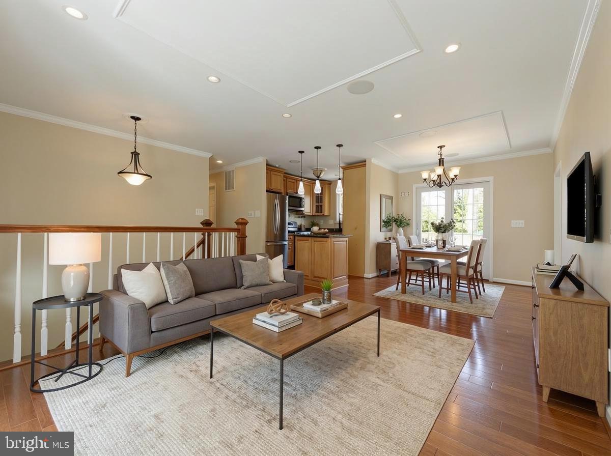 124 Woodland Road Gaithersburg, MD 20877 - Photo 45 of 79 a living room with furniture kitchen view and a flat screen tv
