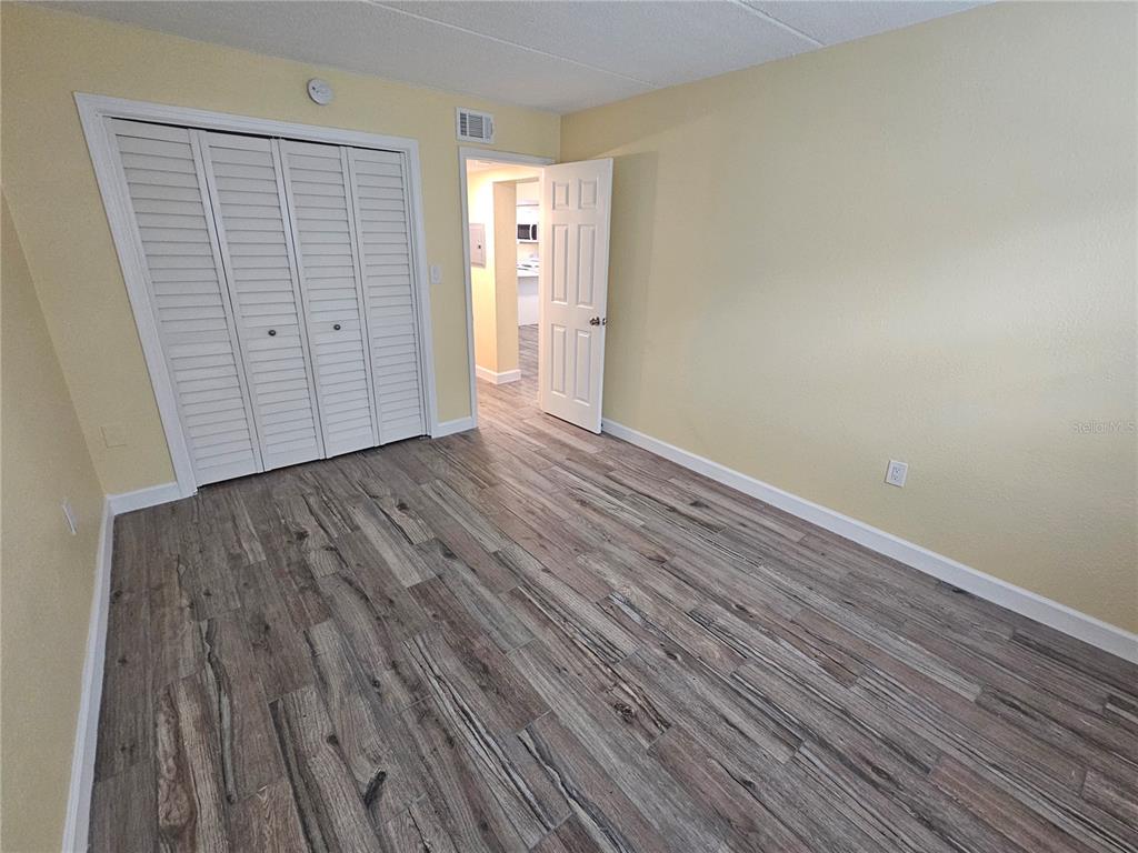 2045 Alpine Road, Unit 3 Clearwater, FL 33755 - Photo 13 of 18 wooden floor in a empty room