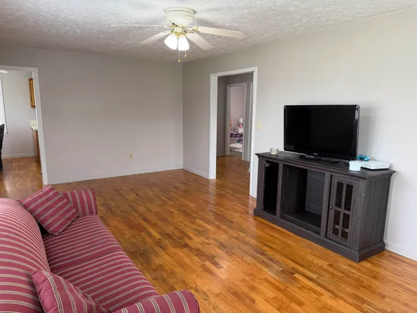 a kitchen with a stove a sink and a refrigerator