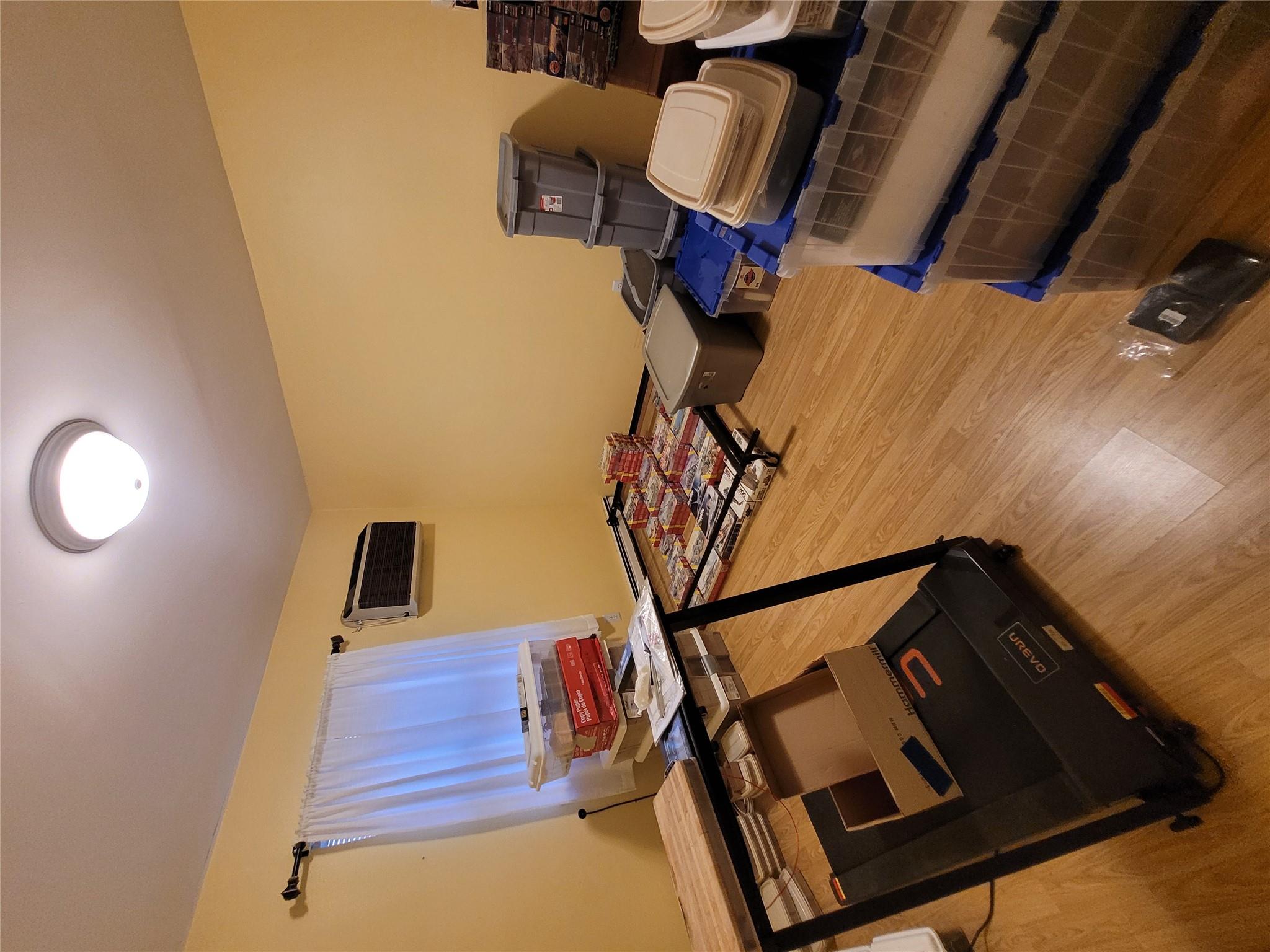 1124 67th Street, Unit A3 Brooklyn, NY 11219 - Photo 11 of 20 Bedroom featuring a wall unit AC and light wood-style floors