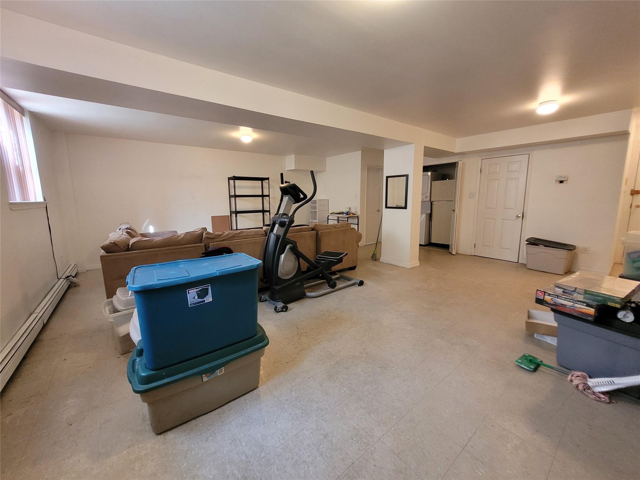 1124 67th Street, Unit A3 Brooklyn, NY 11219 - Photo 13 of 20 Workout room with tile patterned floors and baseboard heating