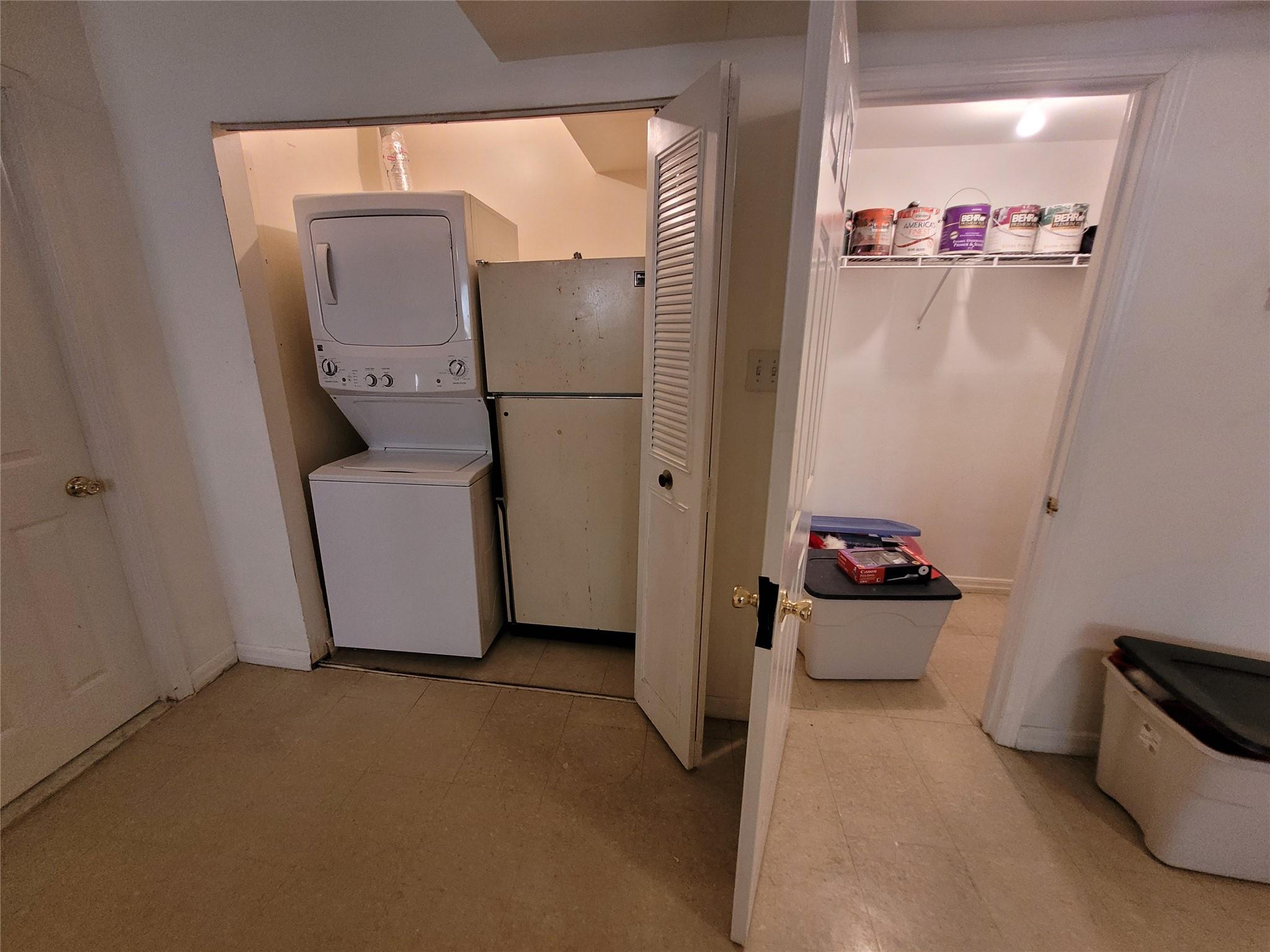 1124 67th Street, Unit A3 Brooklyn, NY 11219 - Photo 16 of 20 Clothes washing area with tile patterned floors and stacked washer / drying machine