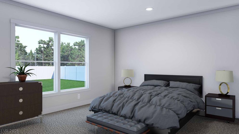 478 Box Canyon Road Alamo, NV 89001 - Photo 9 of 15 Generous windows frame peaceful backyard views in this carpeted bedroom.