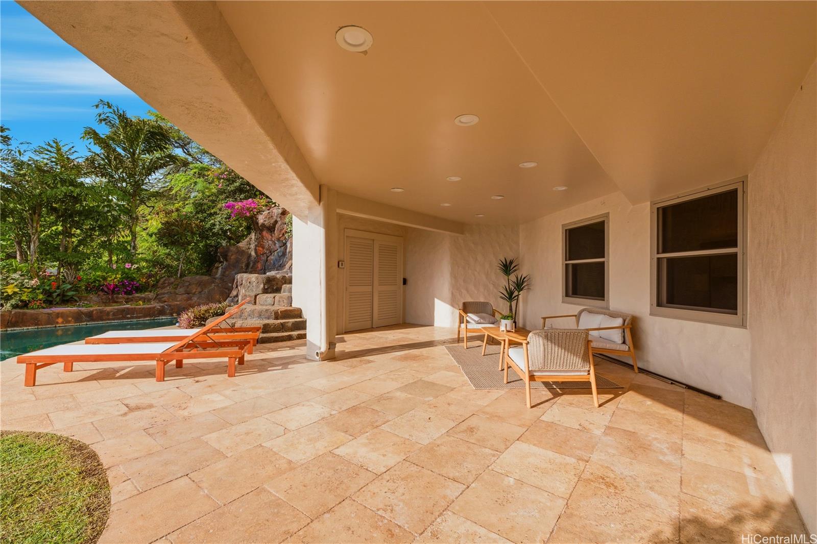 3210 Diamond Head Road, Unit 4 Honolulu, HI 96815 - Photo 21 of 25 a view of a swimming pool with a lounge chairs