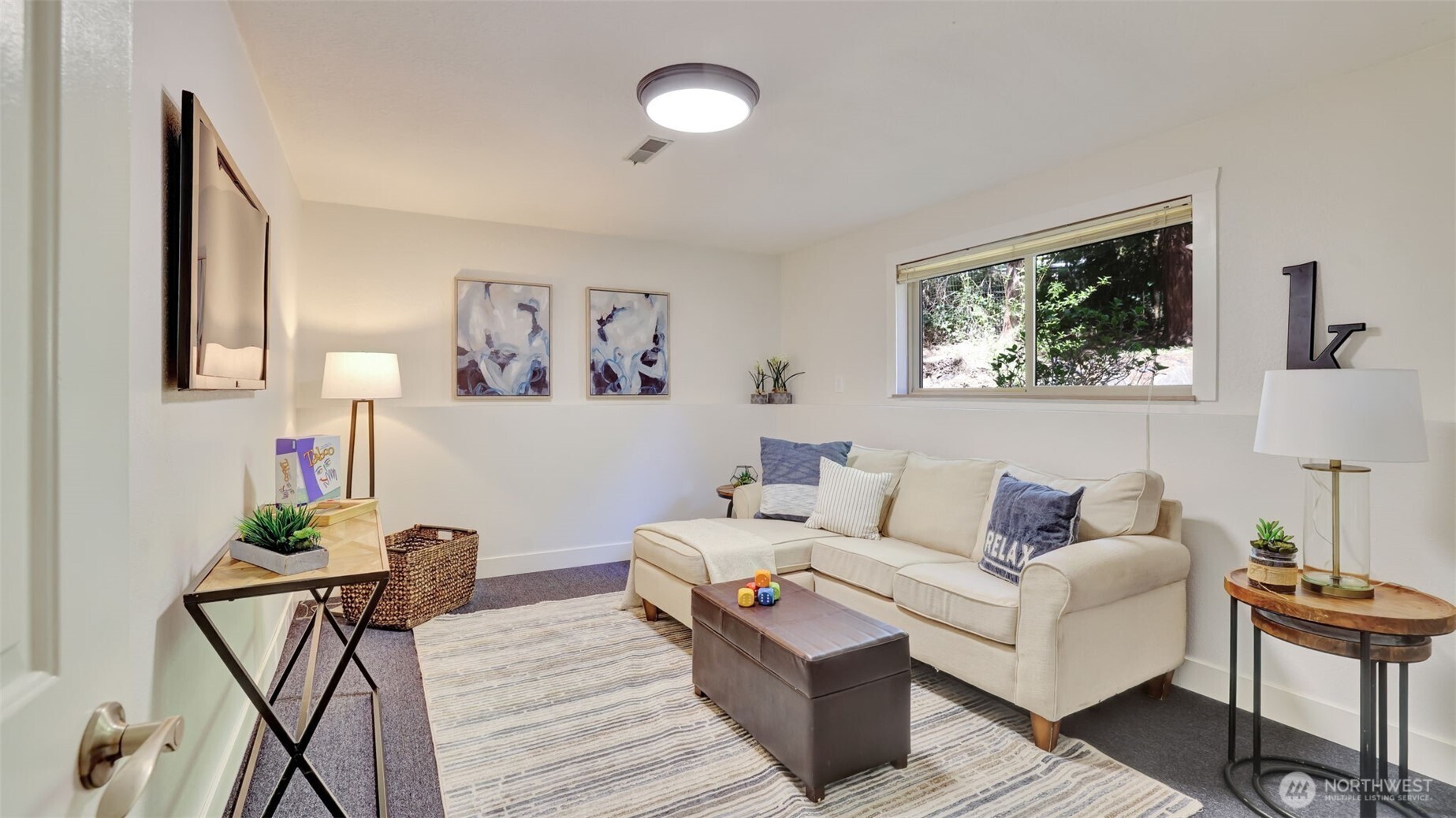 19134 Southeast May Valley Road Issaquah, WA 98027 - Photo 11 of 30 a living room with furniture and a painting on the wall